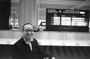 Artist Ho Siu Kee, in the baggage reclaim area after arrival back from New York, Hong Kong International Airport, 22 September 1998