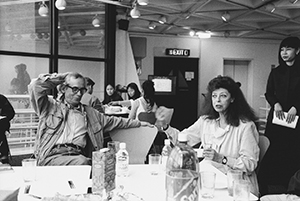 Artists Christo and Jeanne-Claude in discussion with local artists - to the right is Irene Ngan, Hong Kong Arts Centre, Wanchai, 8 February 1999