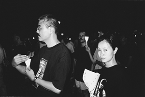 Political cartoonist Zunzi (left) and writer Chen Ya (right) at the June 4th memorial rally, Victoria Park, 4 June 1999