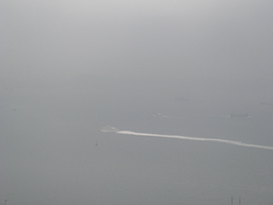 Boat in misty weather, Victoria Harbour, viewed from Sheung Wan, Hong Kong Island, 28 January 2005