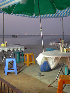 Umbrella blowing in the wind, early evening, Lau Fau Shan, New Territories, 23 January 2005