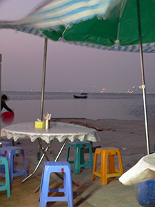 Umbrella blowing in the wind, early evening, Lau Fau Shan, 23 January 2005