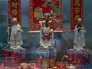 Traditional Chinese god figurines placed in a shop window, Sheung Wan, 13 February 2005