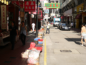 Goods drying on the street after flooding, Wing Lok Street, Sheung Wan, 25 June 2005