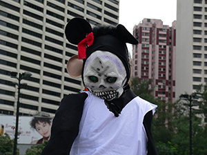 Death's head Disney mask, on the pro-democracy march from Victoria Park to Central, 1 July 2005