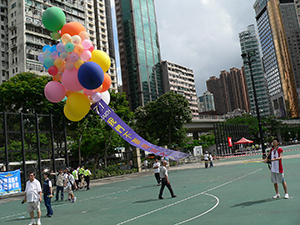 Protest banner on floating balloons, Victoria Park, 1 July 2005