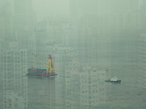 Reflection in a window with tug boat and lighter in Victoria Harbour near Sheung Wan, 7 July 2005