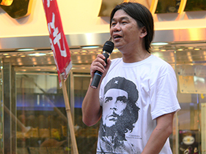 Leung Kwok-hung, addressing participants in a pro-democracy march from Victoria Park to Central, 1 July 2005