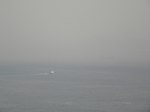 Boat in mist, off Sheung Wan, Hong Kong Island, 7 July 2005