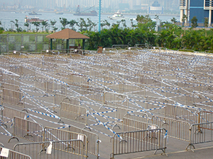 Crowd control measures for the distribution of free rice to the elderly during the Hungry Ghost Festival, Sun Yat Sen Memorial Park, Sheung Wan, 3 September 2005