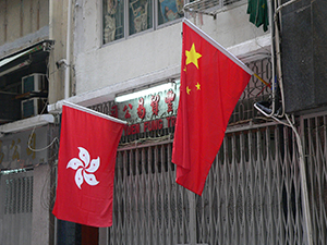 The flags of China and the Hong Kong SAR on display for Chinese National Day, Ko Shing Street, Sheung Wan, 1 October 2005