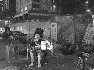 Franco Mella at the ‘Occupy’ protest camp in the public plaza beneath the Hong Kong and Shanghai Bank headquarters, Central, 12 December 2011