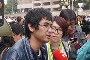 Student leader Alex Chow being interviewed on the final day of the Admiralty Umbrella Movement occupation site, Harcourt Road, 11 December 2014