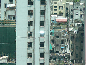 Buildings in Sai Ying Pun with a window reflecting light, Hong Kong Island, 19 June 2007