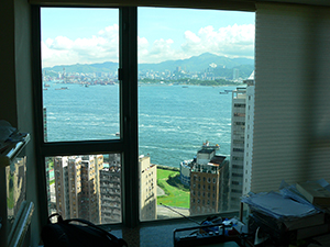 View of Victoria Harbour through a window, Sheung Wan, Hong Kong Island, 23 June 2007