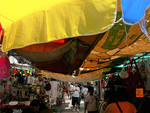Umbrella and awning in a street market, Wanchai, 14 July 2007