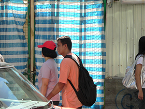 Pedestrians outside a construction site, Wanchai, 14 July 2007