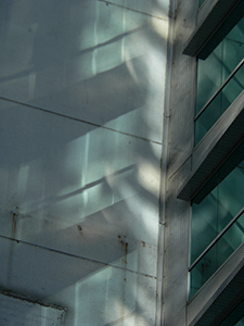 Light reflected from a building facade onto an adjoining wall, Sheung Wan, Hong Kong Island, 19 July 2007