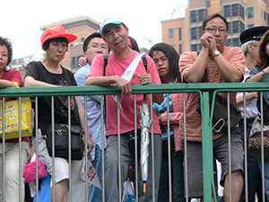 Spectators on the Olympic Bridge watching the annual pro-democracy march, Irving Street, Causeway Bay, 1 July 2007