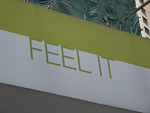 'Feel it' banner outside a construction site, Hong Kong Island, 1 July 2007