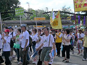 Participants holding banners during the annual pro-democracy march, near Victoria Park, 1 July 2008