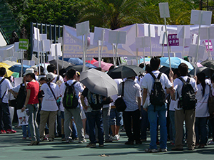 Participants holding banners during the annual pro-democracy march, Victoria Park, 1 July 2008