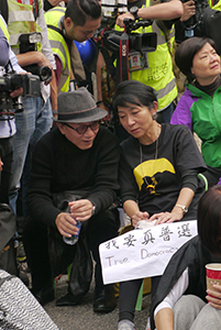 Politician Claudia Mo, participating in a sit-in on the final day of the Admiralty Umbrella Movement occupation site, 11 December 2014