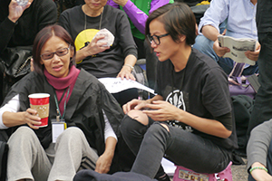 Pop singer Denise Ho, participating in a sit-in on the final day of the Admiralty Umbrella Movement occupation site, 11 December 2014