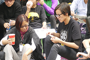 Pop singer Denise Ho, participating in a sit-in on the final day of the Admiralty Umbrella Movement occupation site, 11 December 2014