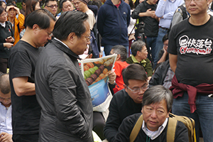 Politicians Albert Ho (left) and Lee Cheuk-yan (right), participating in a sit-in on the final day of the Admiralty Umbrella Movement occupation site, 11 December 2014