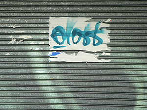 Graffiti on a shop's metal shutters, Tsim Sha Tsui, 24 December 2009