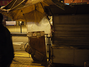 Closed newspaper street stand in Sheung Wan, night, 1 January 2010