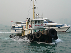 A tug boat approaching the waterfront in Sheung Wan, Victoria Harbour, 20 October 2004