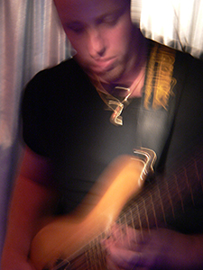 Bass player in a performance at the Blue Door Jazz Club, Central, 17 October 2004