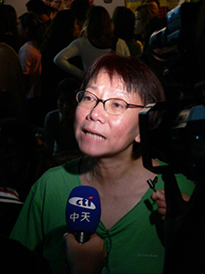 Grace Ma, proprietor of Club 64 and later of Club 71, giving a media interview, WIng Wah Lane, Central, 31 October 2004