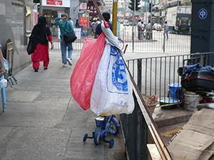 Street scene with plastic bags, To Kwa Wan, 9 October 2004