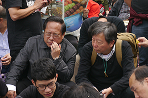 Politicians Albert Ho (left) and Lee Cheuk-yan (right), participating in a sit-in on the final day of the Admiralty Umbrella Movement occupation site, 11 December 2014