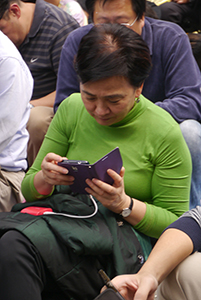 Politician Emily Lau, participating in a sit-in on the final day of the Admiralty Umbrella Movement occupation site, 11 December 2014