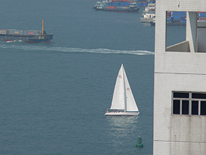 Sailboat in Victoria Harbour, viewed from Sheung Wan, 21 November 2004