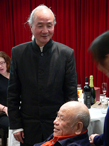 Tsang Tsou Choi, the 'King of Kowloon', a guest at the opening of the restaurant Kin's Kitchen in North Point, with the proprietor, Lau Kin Wai, 28 November 2004