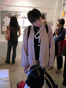 Grace Cheng, at the opening of 'Mapping Identities: The Art and Curating of Oscar Ho', Para Site art space, Po Yan Street, Tai Ping Shan, 5 November 2004