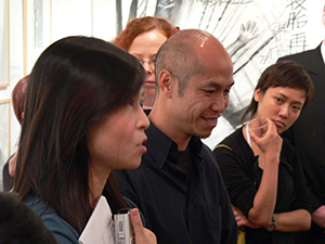 Guests at the opening of 'Mapping Identities: The Art and Curating of Oscar Ho', Para Site art space, 5 November 2004