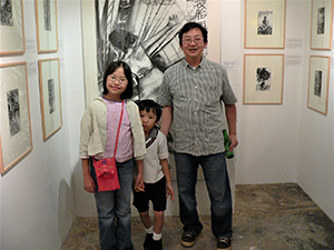 Oscar Ho and his children, at the opening of his exhibition 'Mapping Identities: The Art and Curating of Oscar Ho', Para Site art space, 5 November 2004