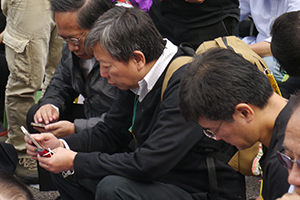Politician Lee Cheuk-yan participating in a sit-in on the final day of the Admiralty Umbrella Movement occupation site, 11 December 2014