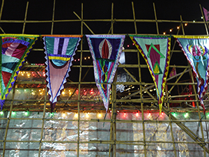 Artworks by Gaylord Chan in the form of flags, displayed on a matshed theatre at the West Kowloon Cultural District site, 18 January 2012