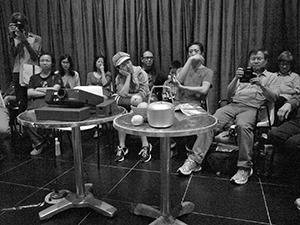 Audience at a poetry reading by Madeleine Slavick, Yau Ma Tei, 29 April 2012