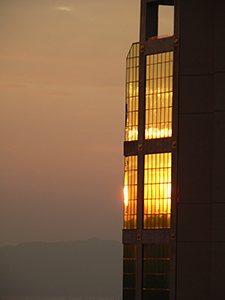 Sunset, with light reflected off a tower block, Sheung Wan, 3 December 2004