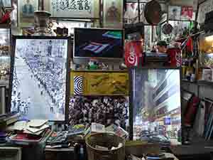 Photographs of Macau as part of an artwork by Leung Mee Ping, installed in a shop in Yau Ma Tei, 14 May 2012