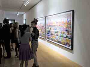 Artworks by an different artist on display in a corridor during an opening party at White Cube for an exhibition of work by Anselm Kiefer, Central, 15 May 2012