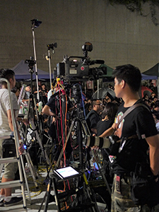 Press cameras at a protest outside the Central Government Offices Complex at Admiralty against an attempt by the Government to introduce national education into the school curriculum, 3 September 2012